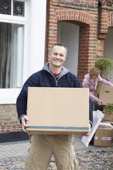 Man with van loading boxes for a London move