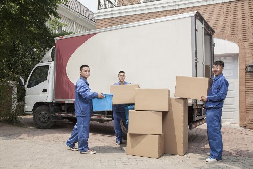 Removal team preparing a London home move with boxes and furniture