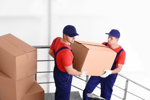 Removal team loading household items in a London street