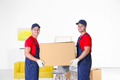 Removal team handling furniture during a scheduled service