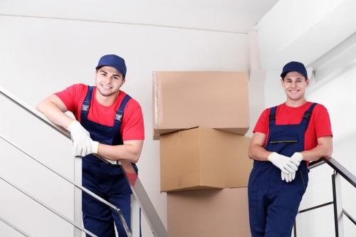 Team moving household items with careful handling