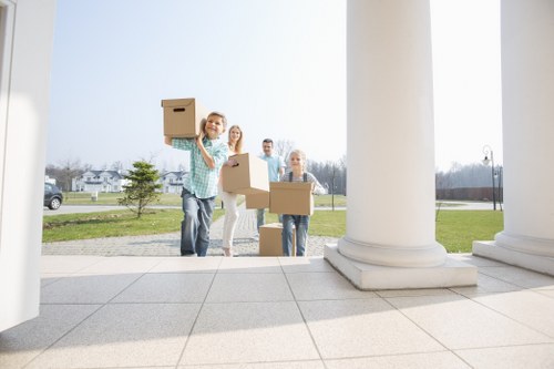Removal team loading furniture for a London home move