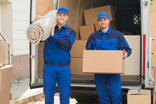 Removal team assisting with office items and furniture transport in London