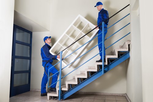 Office removals team moving business furniture in London
