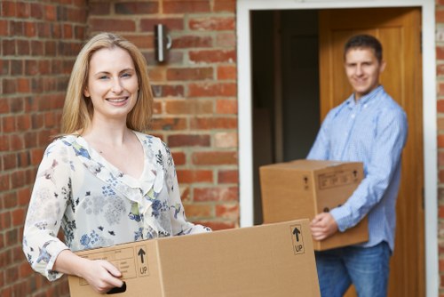 Man and van removals team loading household items in London