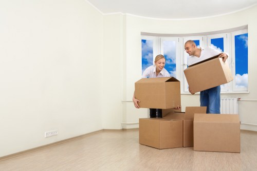 Removal team planning a London home move with boxes and furniture