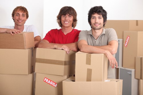 Furniture being carried through a London property stairwell