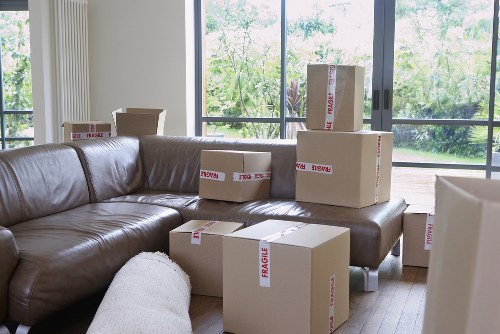 Packed business equipment and labeled boxes ready for transport