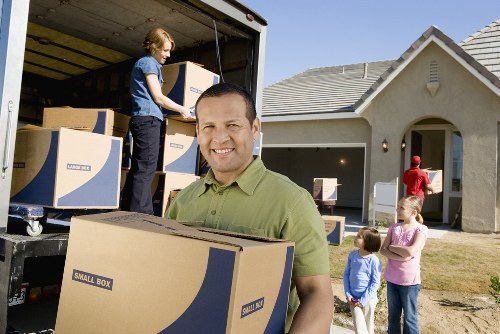 Office removals team transporting business equipment in London